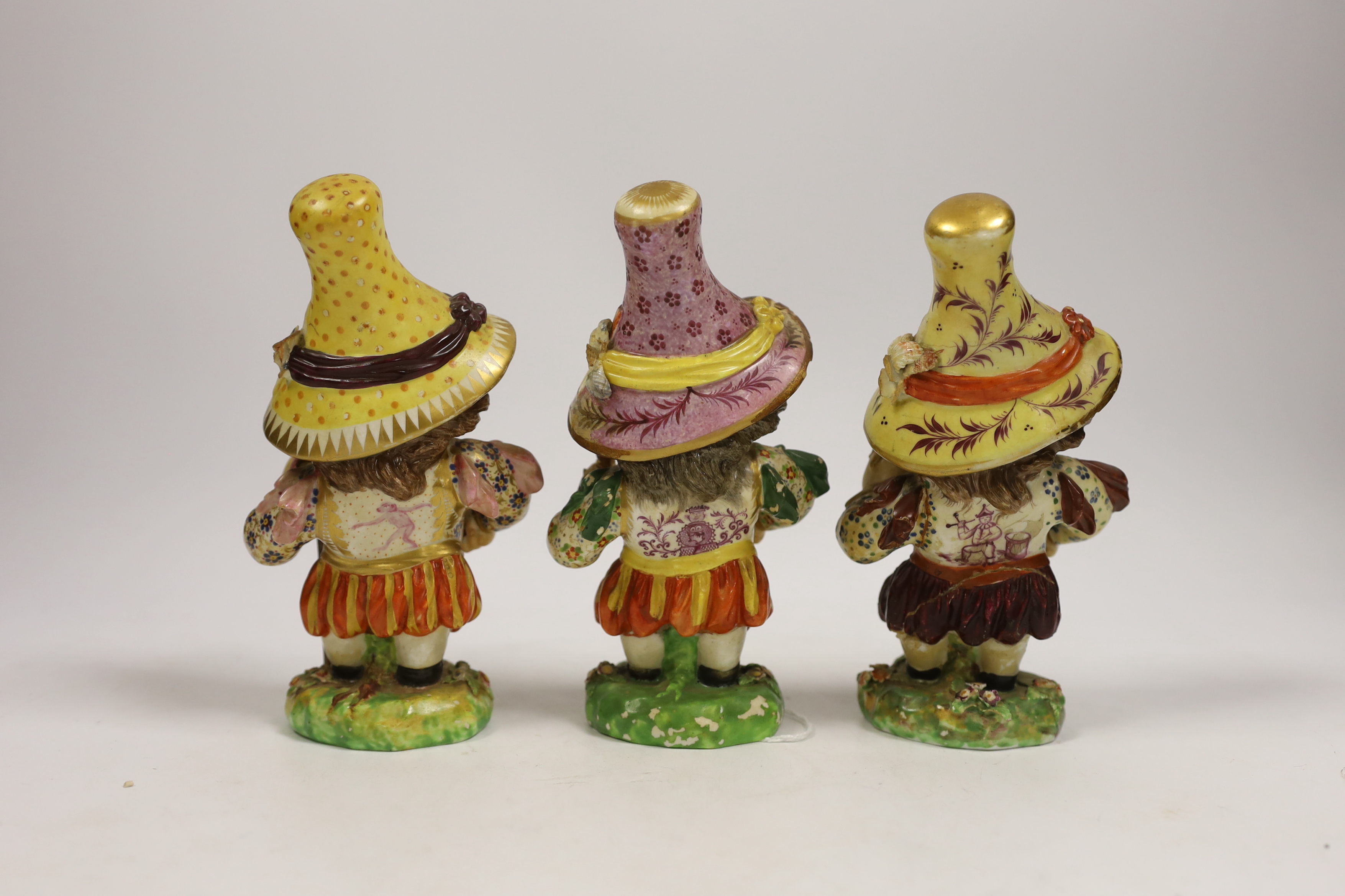 Three Derby porcelain Mansion House dwarves, c.1810-30, incised marks to the bases, 18cm high